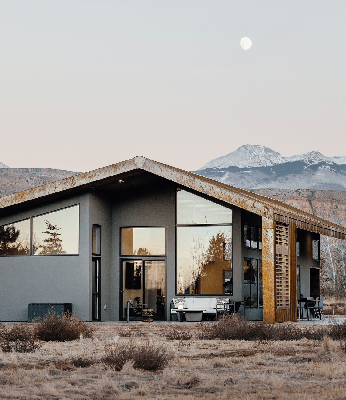 Glass walls framing mountain views